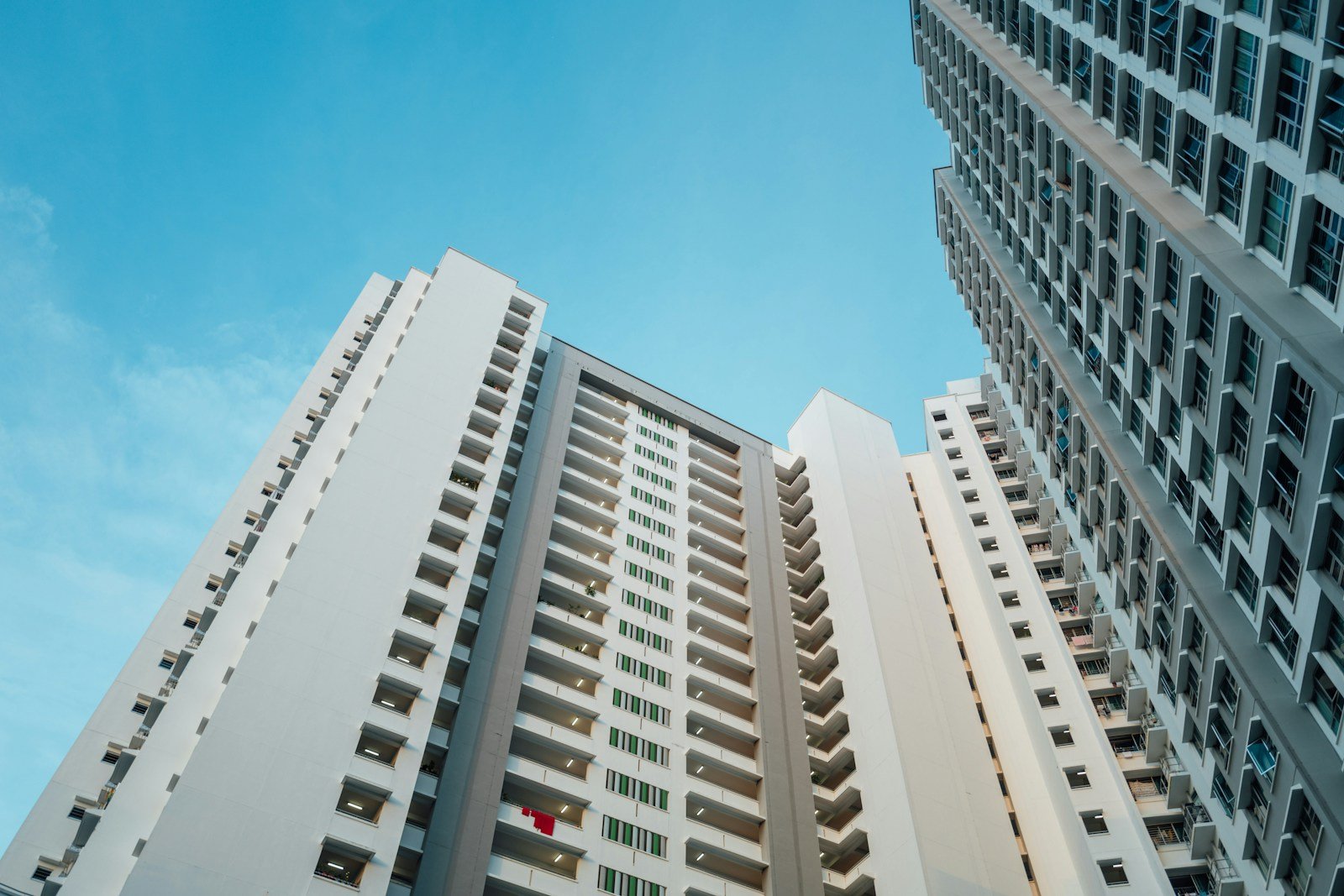 a couple of tall buildings next to each other